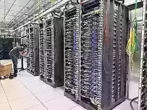 Exclusive Tour of Amazon's Trainium Lab: Chip Wins Anthropic, OpenAI, Apple